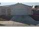 Charming single-story home with a well-maintained front yard and attached two-car garage at 5307 Wild Orchid St, North Las Vegas, NV 89031