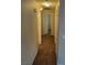The hallway features neutral colored walls and carpeted flooring at 5307 Wild Orchid St, North Las Vegas, NV 89031