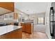 Well-equipped kitchen with neutral tones, tile flooring, and access to dining and living areas at 5307 Wild Orchid St, North Las Vegas, NV 89031