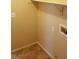 Laundry room featuring tile flooring, shelving and neutral colored walls at 5307 Wild Orchid St, North Las Vegas, NV 89031