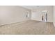 Spacious living room with neutral carpet, ample natural light, and a modern, open layout at 5307 Wild Orchid St, North Las Vegas, NV 89031