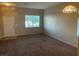 Cozy living room featuring neutral paint, large window and carpet at 5307 Wild Orchid St, North Las Vegas, NV 89031