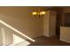 Bright and airy living space with carpet, and stylish chandelier at 5307 Wild Orchid St, North Las Vegas, NV 89031