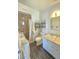This bathroom has a shower and a single sink vanity with a mirror and lots of counter space at 5704 Heron Ave, Las Vegas, NV 89107