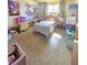 This bedroom features a twin bed, one window, and room for many toys at 5704 Heron Ave, Las Vegas, NV 89107
