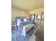 This bedroom features a queen bed, closet, and has ample space at 5704 Heron Ave, Las Vegas, NV 89107