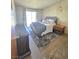 This bedroom features a queen bed, one window, and a dark colored dresser at 5704 Heron Ave, Las Vegas, NV 89107