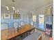Charming dining room features a large wooden table, comfortable seating, and stylish decor at 5704 Heron Ave, Las Vegas, NV 89107