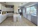 Functional kitchen equipped with white cabinetry, wood countertops, and a central island at 5704 Heron Ave, Las Vegas, NV 89107