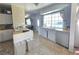Well-lit kitchen with white cabinetry, wood countertops, and modern appliances at 5704 Heron Ave, Las Vegas, NV 89107