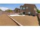 Spacious backyard featuring desert landscaping, block fence, and concrete patio at 5835 Running Horse Dr, North Las Vegas, NV 89081