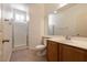 Bathroom with modern fixtures, including a vanity, toilet, and glass-enclosed shower at 5835 Running Horse Dr, North Las Vegas, NV 89081