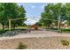 A vibrant playground featuring a swing set and play equipment nestled between benches at 5835 Running Horse Dr, North Las Vegas, NV 89081