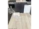Sample of material selections with gray flooring, cabinets, countertops, and sleek chrome faucet at 5870 Kips Bay St, Las Vegas, NV 89148