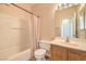 A bathroom featuring a sink, vanity, mirror, tile flooring, toilet, and a shower at 5950 Barbosa Dr # 8, North Las Vegas, NV 89031
