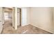 A neutral bedroom featuring carpet, base molding, and a double door closet at 5950 Barbosa Dr # 8, North Las Vegas, NV 89031