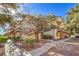 A condo exterior with a sidewalk and decorative landscaping including a tree at 5950 Barbosa Dr # 8, North Las Vegas, NV 89031