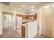 Well-lit kitchen features oak cabinets, white appliances, and neutral countertops and floors at 5950 Barbosa Dr # 8, North Las Vegas, NV 89031