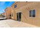 Back of house with access to a balcony and sliding glass door at 6019 Sonoma Station Ave, Las Vegas, NV 89139