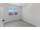 Cozy bedroom with wood-look floors and a window offering outdoor views at 6019 Sonoma Station Ave, Las Vegas, NV 89139