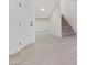 Inviting foyer with modern flooring, a staircase, and a well-lit entrance at 6019 Sonoma Station Ave, Las Vegas, NV 89139