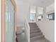 Inviting entryway with tile flooring, a staircase, and natural light streaming through the doorway at 6019 Sonoma Station Ave, Las Vegas, NV 89139