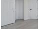 Hallway with wood-look floors, connecting various rooms within the home at 6019 Sonoma Station Ave, Las Vegas, NV 89139