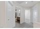 Upstairs hallway with access to bedroom and bathroom with wood-look floors at 6019 Sonoma Station Ave, Las Vegas, NV 89139