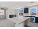 Bright, modern kitchen with stainless steel appliances, island, and quartz countertops at 6019 Sonoma Station Ave, Las Vegas, NV 89139
