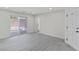Spacious living room with sliding glass doors to pool and neutral color palette at 6019 Sonoma Station Ave, Las Vegas, NV 89139