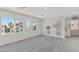 Spacious living area with bright windows and view to outside, featuring the home's modern staircase at 6019 Sonoma Station Ave, Las Vegas, NV 89139
