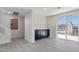 Stylish living area with dark cabinetry, quartz countertop bar, and a sliding glass door leading to the patio at 6019 Sonoma Station Ave, Las Vegas, NV 89139