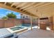 Backyard pool with brick walls and covered patio at 6019 Sonoma Station Ave, Las Vegas, NV 89139