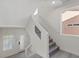 Bright staircase with glass railing and large windows allowing for ample natural light in a modern home at 6019 Sonoma Station Ave, Las Vegas, NV 89139