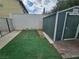 Enclosed backyard with a storage shed and minimal landscaping for low maintenance at 6500 Hill View Ave, Las Vegas, NV 89107