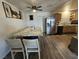 Spacious kitchen features a large island and stainless steel refrigerator at 6500 Hill View Ave, Las Vegas, NV 89107