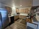 Modern kitchen with updated stainless steel appliances and convenient layout at 6500 Hill View Ave, Las Vegas, NV 89107
