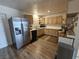 Bright kitchen with stainless steel refrigerator, updated cabinets and fixtures at 6500 Hill View Ave, Las Vegas, NV 89107