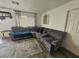 Comfortable living room featuring a spacious sectional sofa and modern accents at 6500 Hill View Ave, Las Vegas, NV 89107