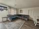 Cozy living room with a large sectional sofa and stylish decor at 6500 Hill View Ave, Las Vegas, NV 89107