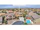 Beautiful aerial view of the property showcasing a sparkling pool, lush landscaping, and well-manicured lawn at 6659 Alder Flower Ct, North Las Vegas, NV 89084