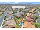 Stunning aerial view of the property with a well-manicured lawn, swimming pool, and desert landscape at 6659 Alder Flower Ct, North Las Vegas, NV 89084