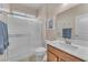Bathroom featuring tiled shower, single vanity, and a large mirror at 6659 Alder Flower Ct, North Las Vegas, NV 89084