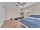 Bedroom featuring a ceiling fan and workout equipment including a treadmill at 6659 Alder Flower Ct, North Las Vegas, NV 89084