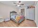 Bedroom featuring a cozy bed, ceiling fan, and stylish decor at 6659 Alder Flower Ct, North Las Vegas, NV 89084