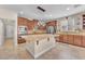 Well-equipped kitchen with stainless steel appliances, granite countertops, and a central island with pendant lighting at 6659 Alder Flower Ct, North Las Vegas, NV 89084