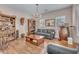 Cozy living room with chandelier, stylish furniture, and natural light creating a comfortable atmosphere at 6659 Alder Flower Ct, North Las Vegas, NV 89084