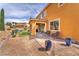 Charming patio area with outdoor seating, surrounded by landscaped gardens and a tranquil atmosphere at 6659 Alder Flower Ct, North Las Vegas, NV 89084