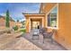 Inviting patio with seating, perfect for outdoor gatherings and enjoying the landscaped backyard at 6659 Alder Flower Ct, North Las Vegas, NV 89084