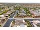 Expansive aerial view of a desert community featuring well-maintained homes and landscaping in a planned neighborhood at 6728 Regency Ridge Ct, Las Vegas, NV 89148